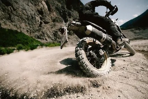 Rider testing Continental TKC 802 dual-sport tyre on trail