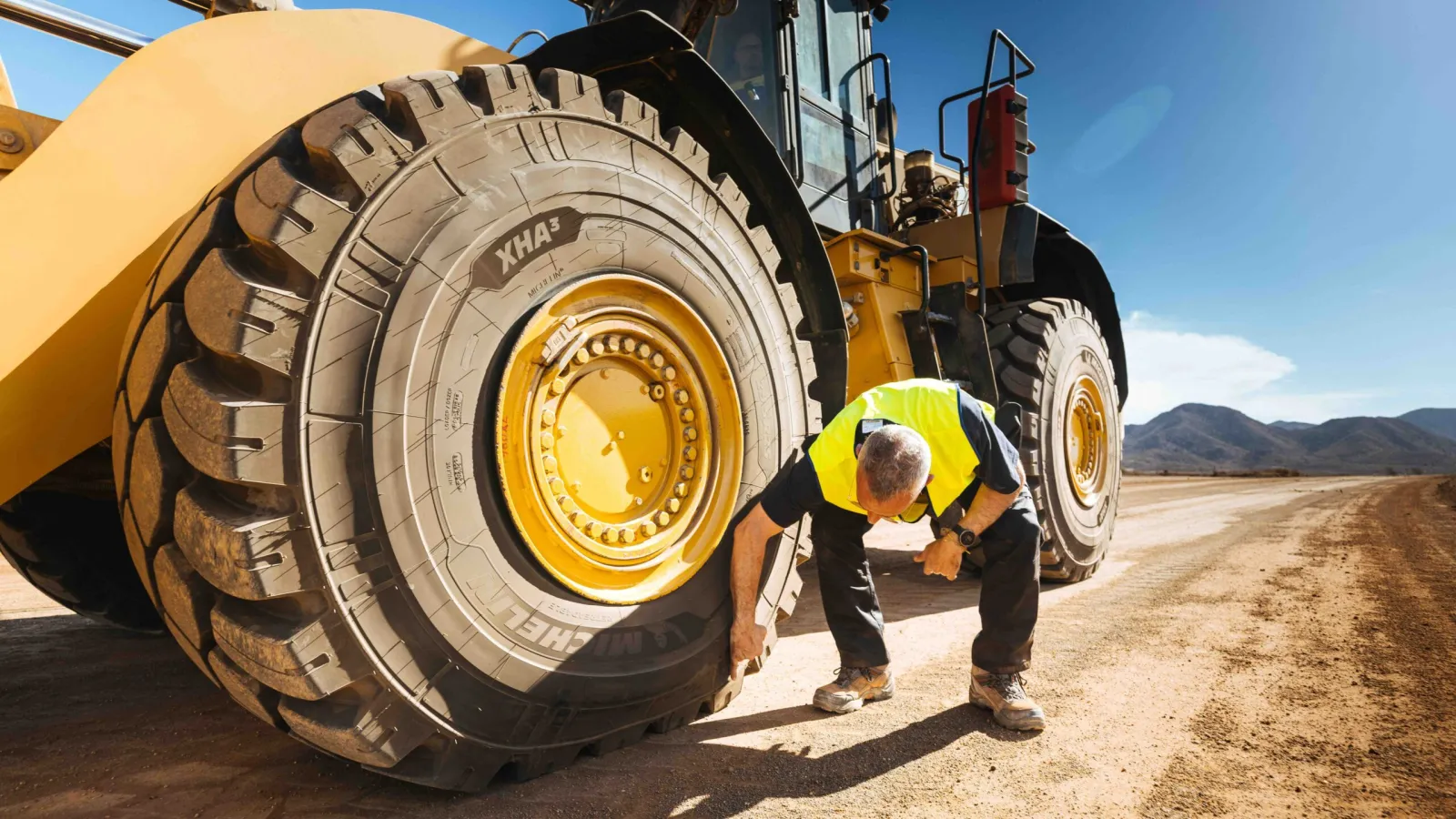 A massive Michelin XHA3 earthmover loader tyre mounted on a heavy equipment vehicle. (Photo: Michelin)